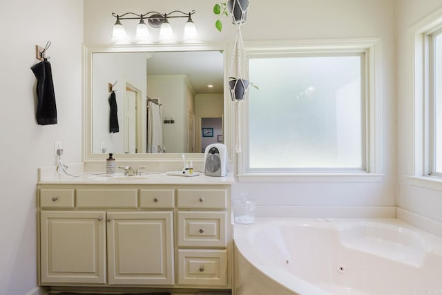 51 Waters Edge Dr, Little Rock, AR 72204 - bathroom featuring a jetted tub and vanity