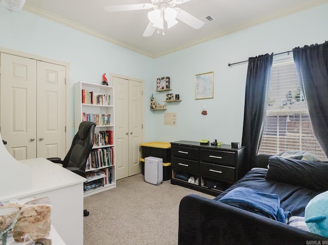 51 Waters Edge Dr, Little Rock, AR 72204 - carpeted bedroom featuring ornamental molding, two closets, a ceiling fan, and a desk