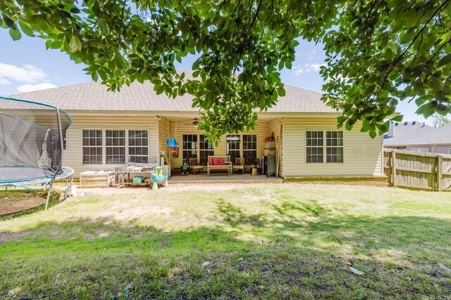 51 Waters Edge Dr, Little Rock, AR 72204 - back of house with a trampoline, ceiling fan, and a shingled roof