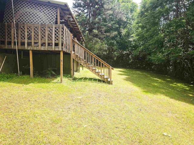 163 Junior Cir, Clinton, AR 72031 - view of green lawn featuring stairs and a wooden deck