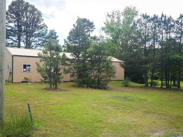 163 Junior Cir, Clinton, AR 72031 - view of grassy yard featuring an outbuilding