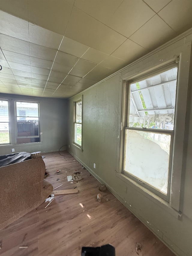 empty room with wood finished floors and baseboards
