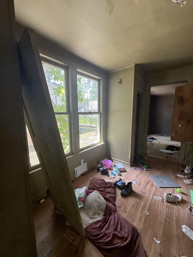 miscellaneous room with wood finished floors and baseboards