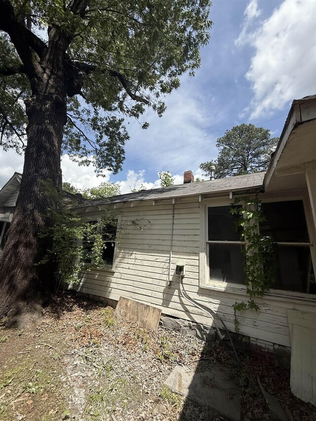 view of home's exterior featuring a chimney
