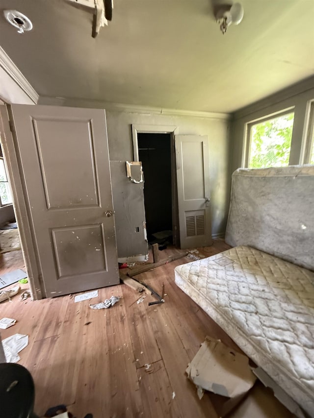 bedroom with hardwood / wood-style flooring