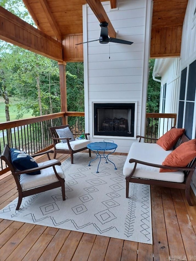 32 Propio Way, Hot Springs Village, AR 71909 - wooden terrace with a large fireplace and a ceiling fan