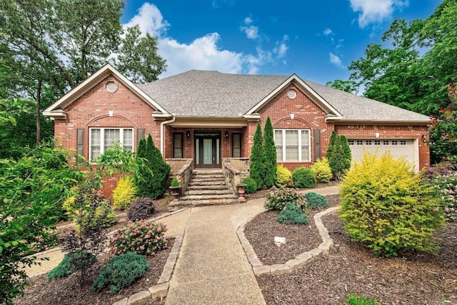 134 Myrick Ln, Hot Springs, AR 71913 - view of front of house featuring brick siding, a shingled roof, a garage, and a porch