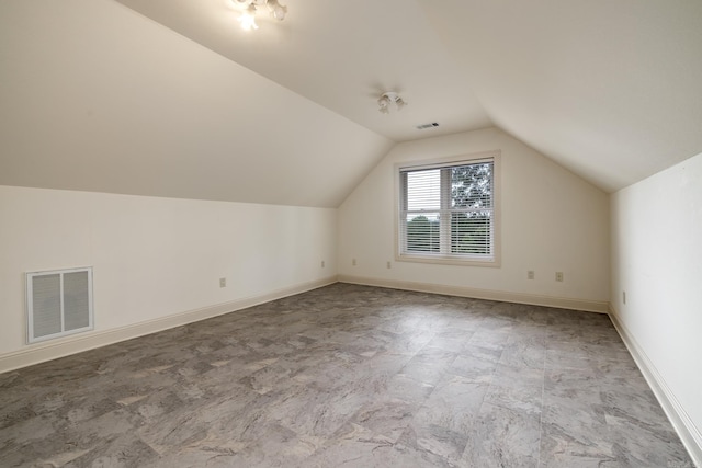134 Myrick Ln, Hot Springs, AR 71913 - additional living space with lofted ceiling, light stone finish flooring, and baseboards