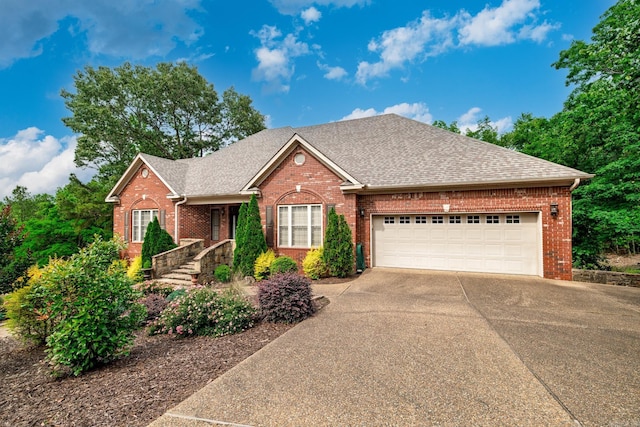 134 Myrick Ln, Hot Springs, AR 71913 - view of front of property featuring brick siding, driveway, an attached garage, and roof with shingles