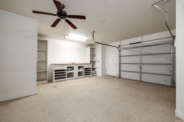 134 Myrick Ln, Hot Springs, AR 71913 - garage with a ceiling fan and concrete block wall
