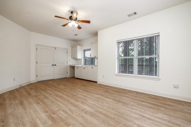 134 Myrick Ln, Hot Springs, AR 71913 - unfurnished living room with light wood finished floors, ceiling fan, and baseboards