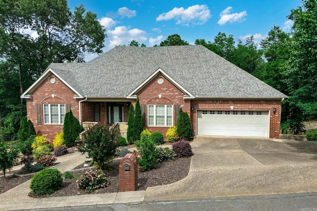 134 Myrick Ln, Hot Springs, AR 71913 - view of front of property with brick siding, a shingled roof, a garage, and concrete driveway