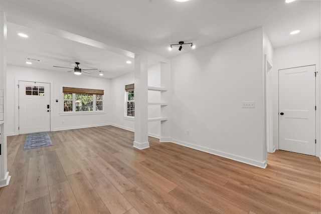 unfurnished living room with ceiling fan, light wood finished floors, recessed lighting, and baseboards