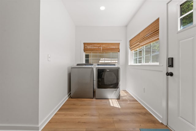 washroom with independent washer and dryer, light wood finished floors, baseboards, and recessed lighting