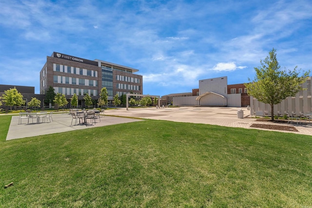 view of property's community with a lawn