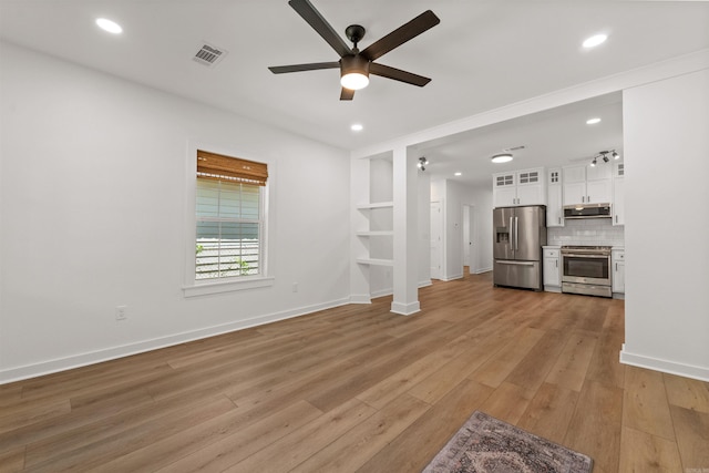 unfurnished living room featuring ceiling fan, light wood-style floors, baseboards, recessed lighting, and built in features