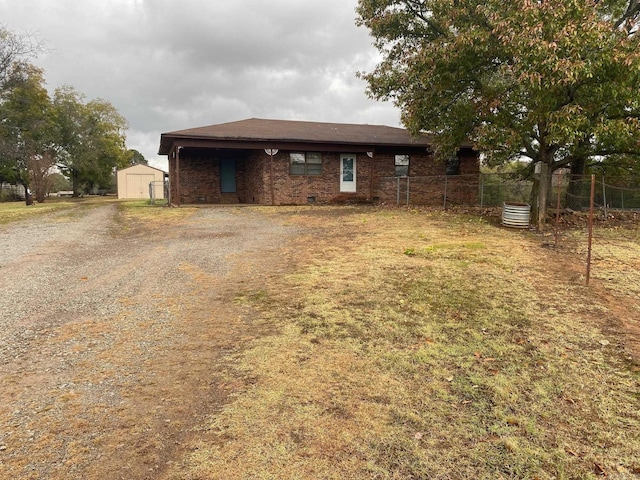 18 Garland Spgs, Mount Vernon, AR 72111 - back of property featuring a shed, fence, an outbuilding, and driveway