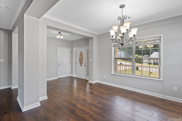 entryway featuring a chandelier, wood-type flooring, crown molding, and baseboards