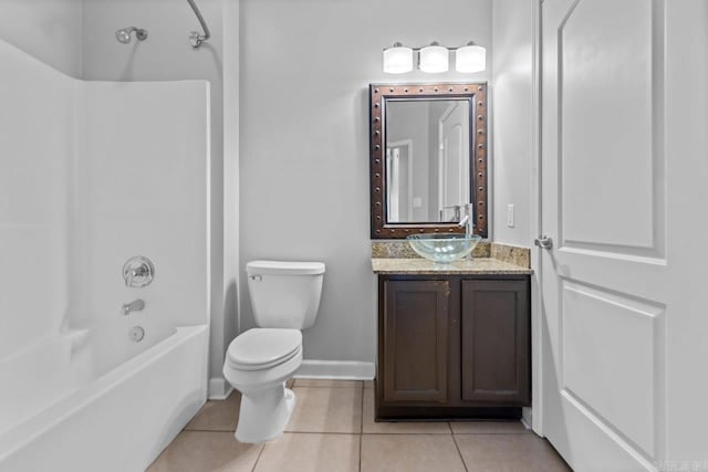 bathroom with tile patterned flooring, toilet, shower / washtub combination, vanity, and baseboards