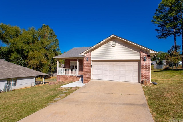 view of front of house with brick siding, an attached garage, a front lawn, driveway, and covered porch