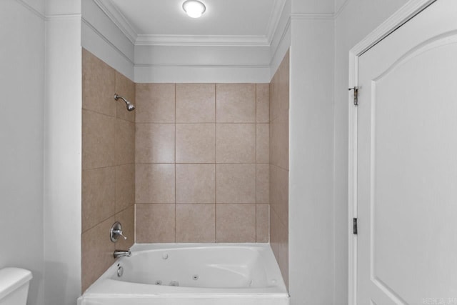 bathroom featuring toilet, ornamental molding, and a combined bath / shower with jetted tub
