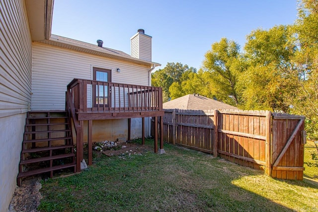 view of yard with stairs and a wooden deck