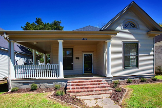 1409 Allis St, Little Rock, AR 72204 - view of front of home with a porch, a front lawn, and crawl space