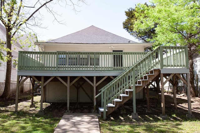 1409 Allis St, Little Rock, AR 72204 - back of house featuring a shingled roof, a wooden deck, and stairway