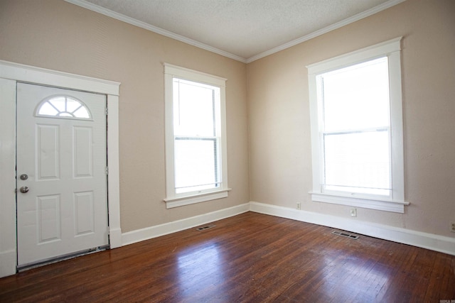 1409 Allis St, Little Rock, AR 72204 - entryway featuring wood finished floors, crown molding, baseboards, and a textured ceiling