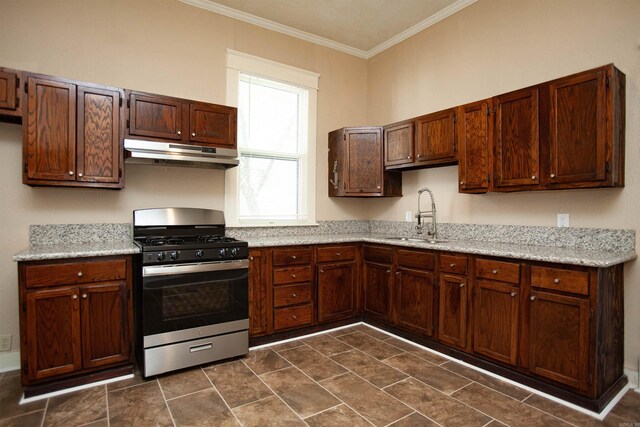 1409 Allis St, Little Rock, AR 72204 - kitchen featuring stainless steel range with gas cooktop, under cabinet range hood, a sink, and crown molding
