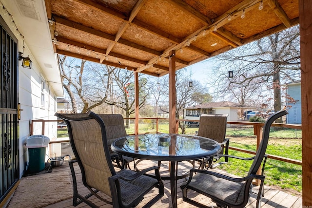 wooden deck with outdoor dining space