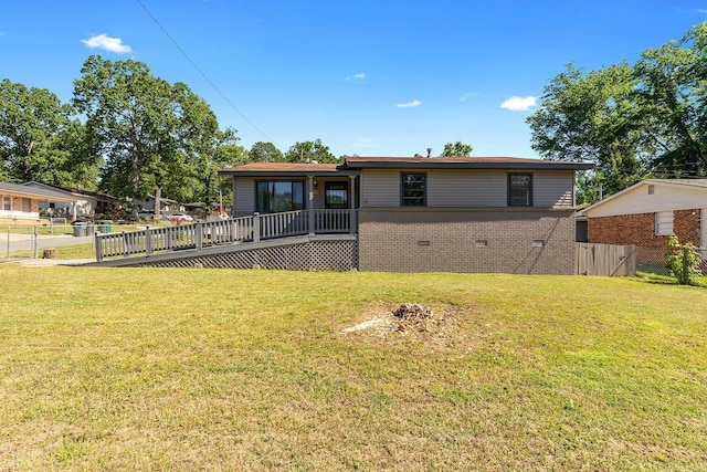 rear view of property with a wooden deck, crawl space, and brick siding