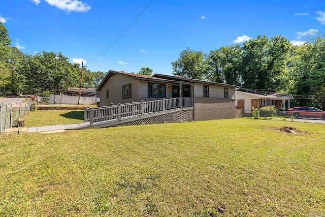 view of front of property featuring brick siding and a deck
