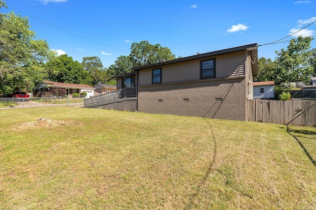 back of property featuring brick siding