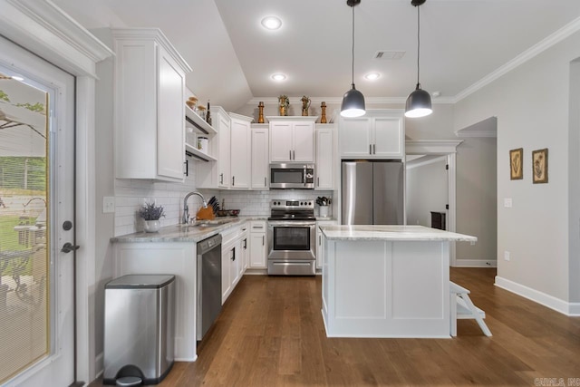 641 Lucy Ln, Alexander, AR 72002 - kitchen with appliances with stainless steel finishes, a sink, open shelves, decorative backsplash, and a center island