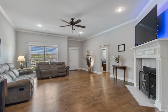 641 Lucy Ln, Alexander, AR 72002 - living room with a ceiling fan, a tiled fireplace, recessed lighting, wood finished floors, and ornamental molding