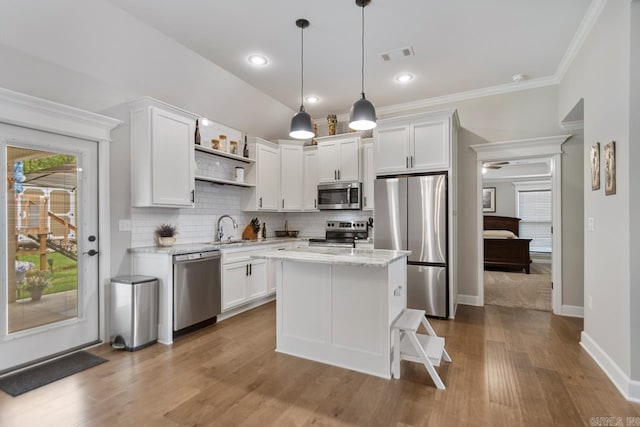 641 Lucy Ln, Alexander, AR 72002 - kitchen with appliances with stainless steel finishes, open shelves, a sink, white cabinetry, and crown molding