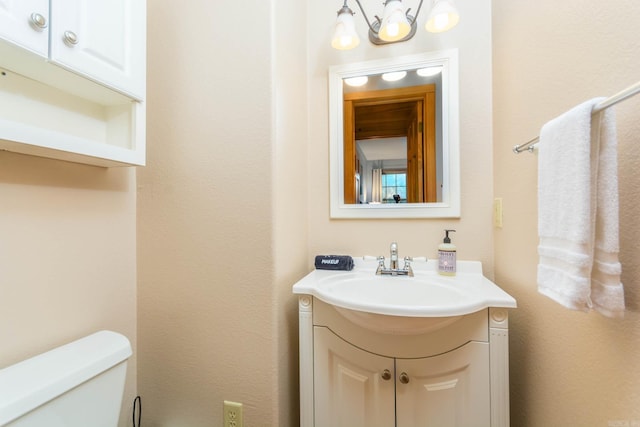 221 Skyline Dr, Greers Ferry, AR 72067 - half bath with toilet, vanity, and a chandelier