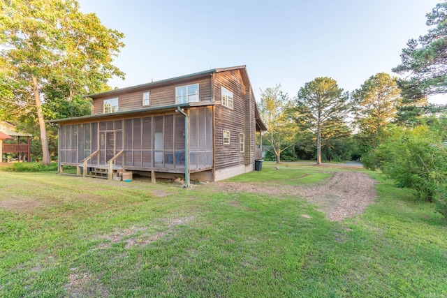 221 Skyline Dr, Greers Ferry, AR 72067 - rear view of property featuring a sunroom and a lawn