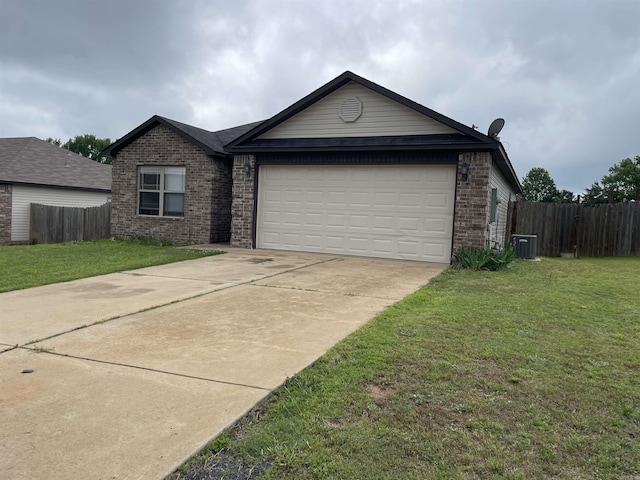 103 Sunflower Ln, Beebe, AR 72012 - view of front of home with brick siding, central air condition unit, concrete driveway, and an attached garage