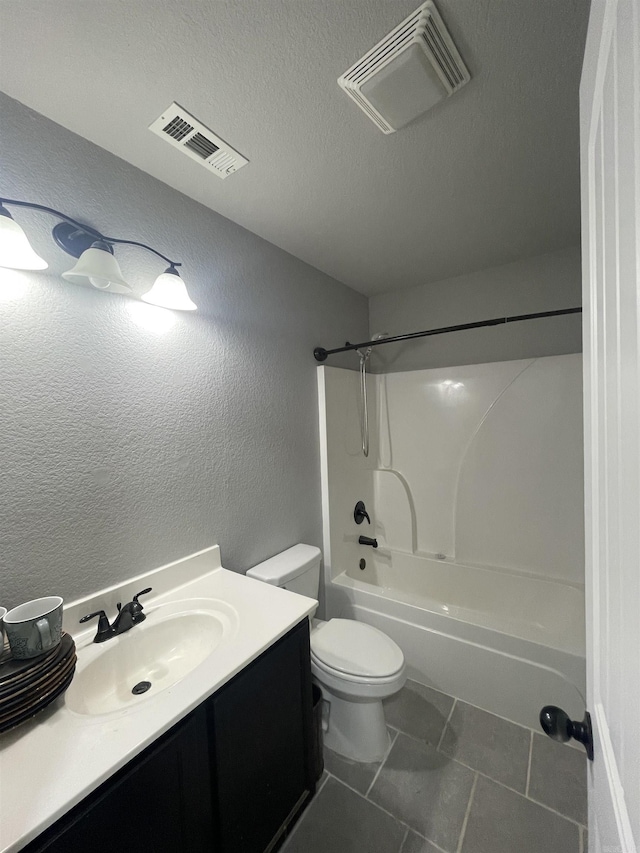 103 Sunflower Ln, Beebe, AR 72012 - bathroom with toilet, vanity, shower / bath combination, a textured ceiling, and a textured wall