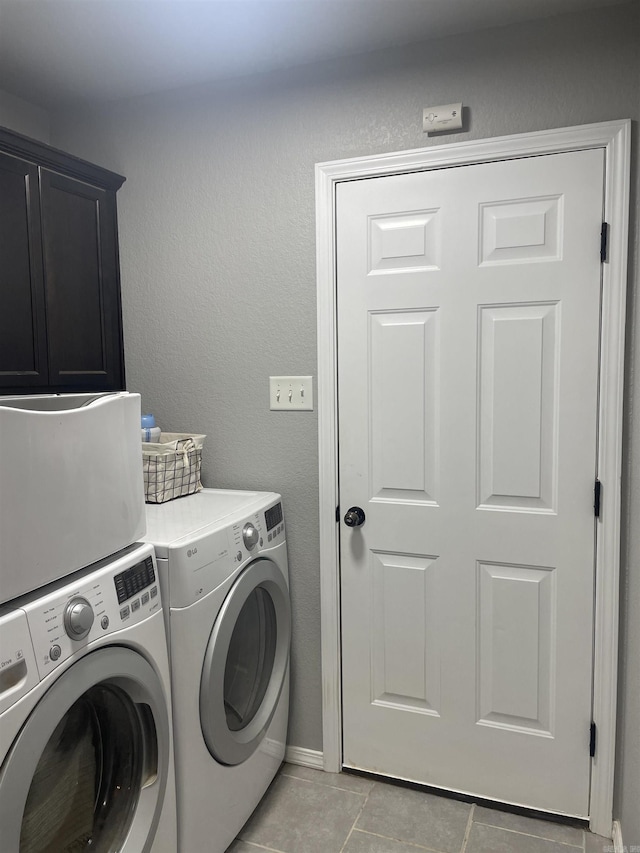 103 Sunflower Ln, Beebe, AR 72012 - clothes washing area with cabinet space, light tile patterned floors, washing machine and dryer, and baseboards