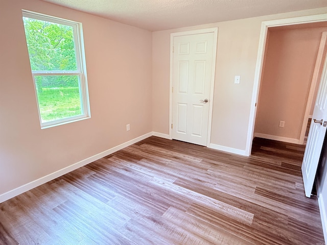 4090 Ar 56th Hwy, Wideman, AR 72585 - unfurnished bedroom with wood finished floors and baseboards