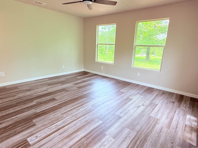 4090 Ar 56th Hwy, Wideman, AR 72585 - empty room featuring a ceiling fan, wood finished floors, and baseboards