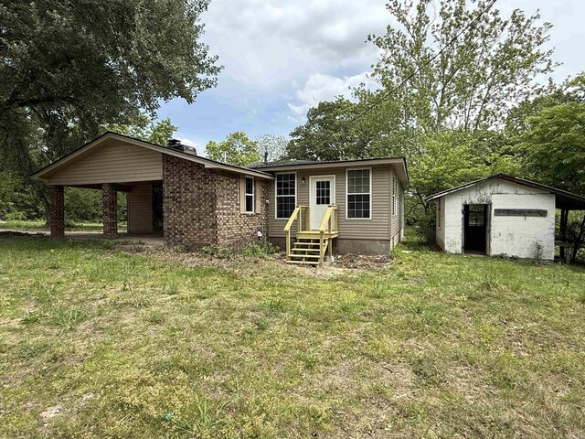 4090 Ar 56th Hwy, Wideman, AR 72585 - rear view of property with a chimney, a lawn, and an outbuilding