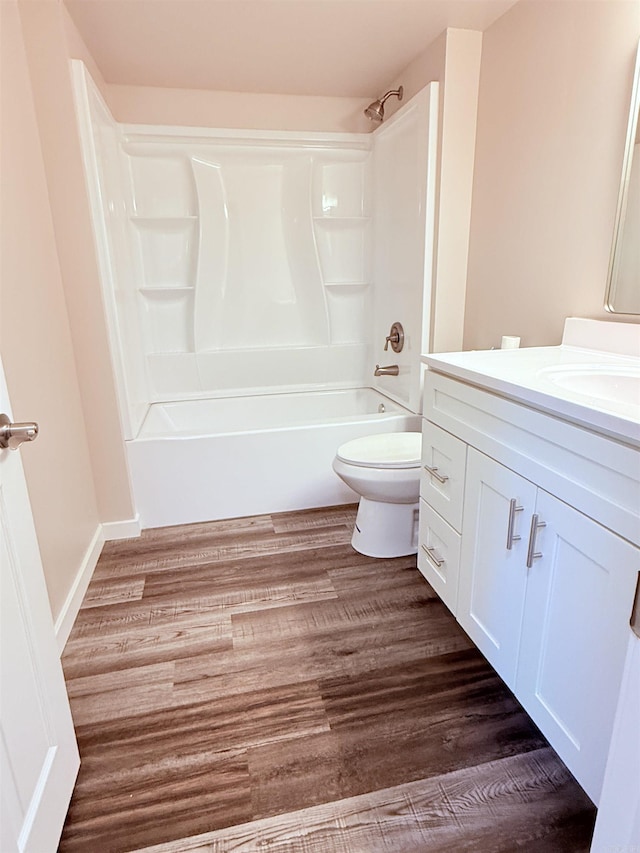 4090 Ar 56th Hwy, Wideman, AR 72585 - bathroom with toilet, vanity, shower / washtub combination, and wood finished floors