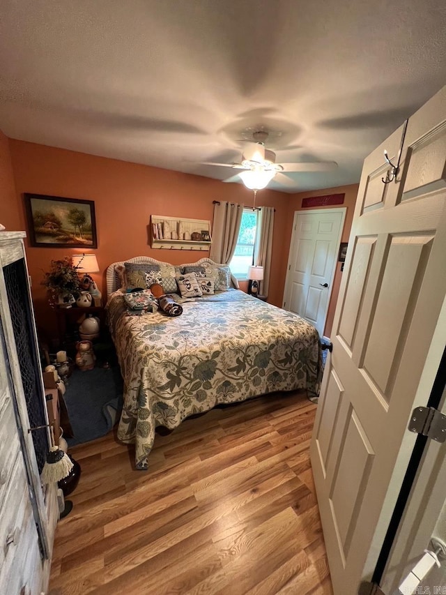 49 Tram, Perryville, AR 72126 - bedroom featuring light wood-style flooring and a ceiling fan