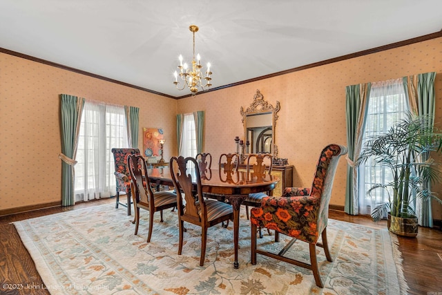1920 Airpark Rd, Wynne, AR 72396 - dining area featuring crown molding, a chandelier, wood finished floors, healthy amount of natural light, and wallpapered walls