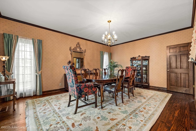 1920 Airpark Rd, Wynne, AR 72396 - dining area with crown molding, a chandelier, wood finished floors, baseboards, and wallpapered walls