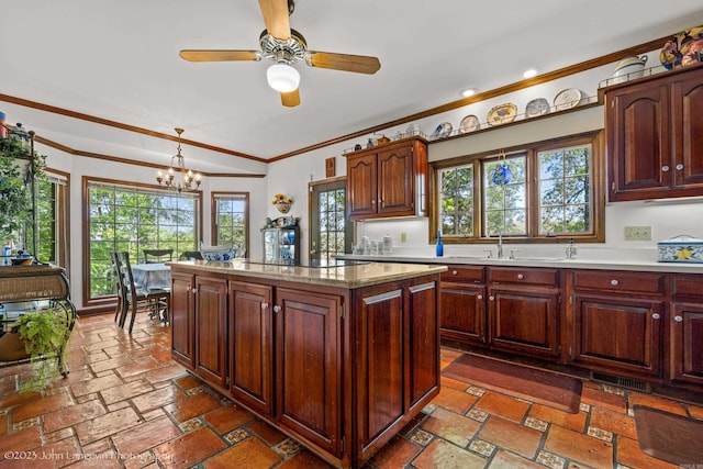 1920 Airpark Rd, Wynne, AR 72396 - kitchen with crown molding, a chandelier, hanging light fixtures, a ceiling fan, and a center island